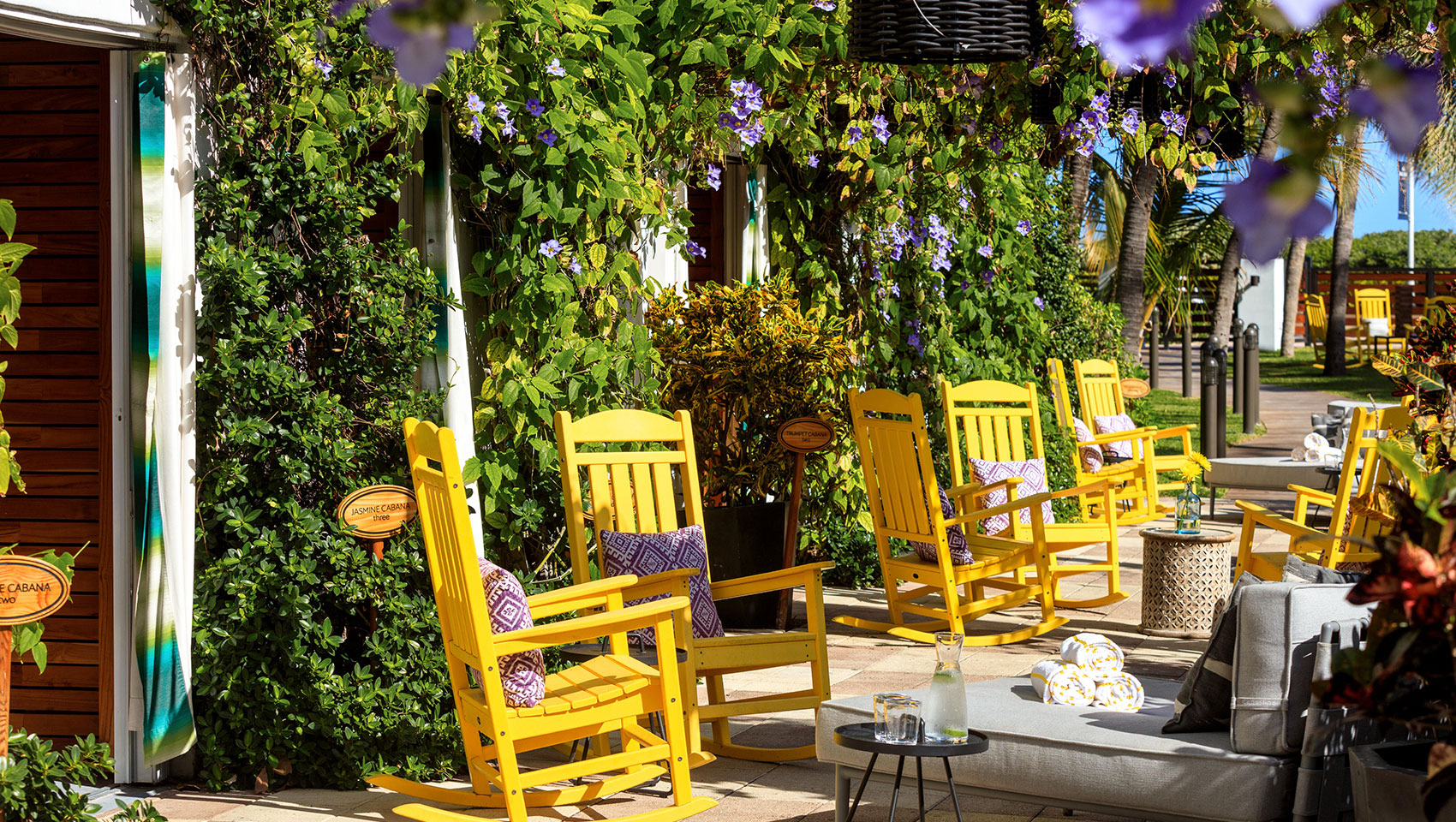 private pool cabanas with chairs outside