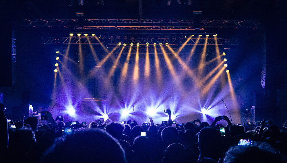 View of crowd at a live concert from behind